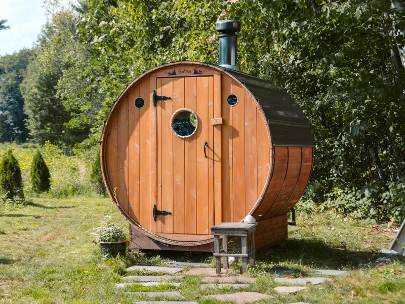 Wooden barrel sauna in a backyard