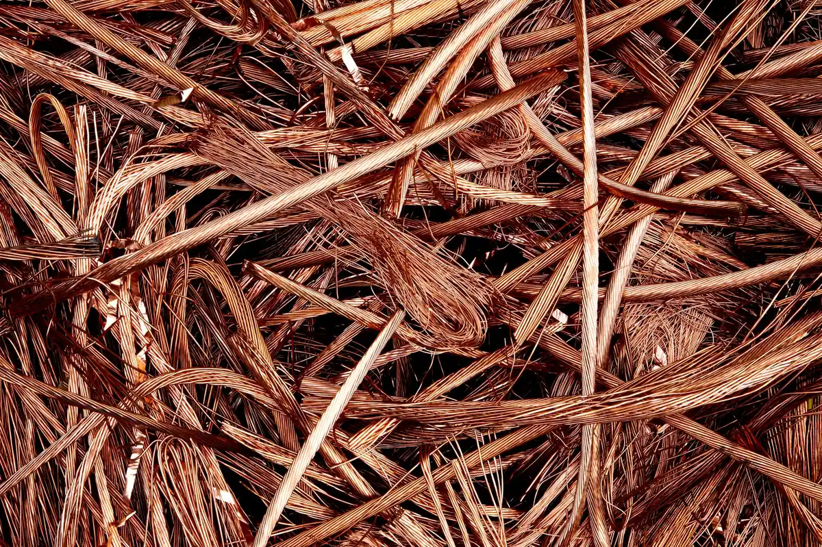 Close-up of a pile of bare copper wire strands and solid copper conductors